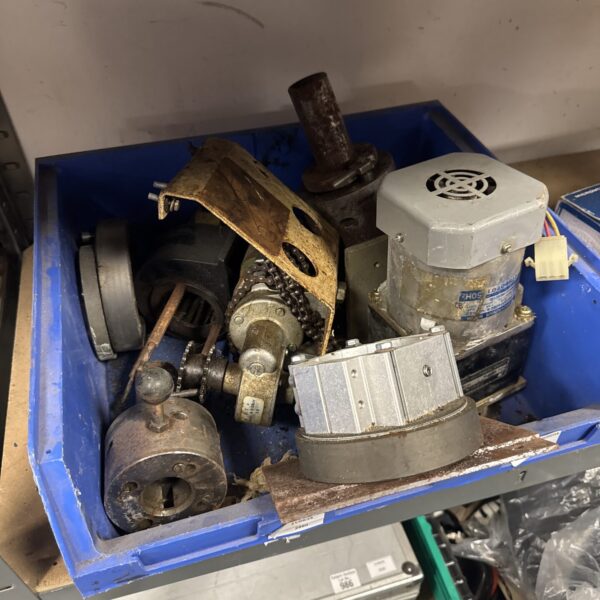 Selection of engineering equipment including a motor and lathe parts.