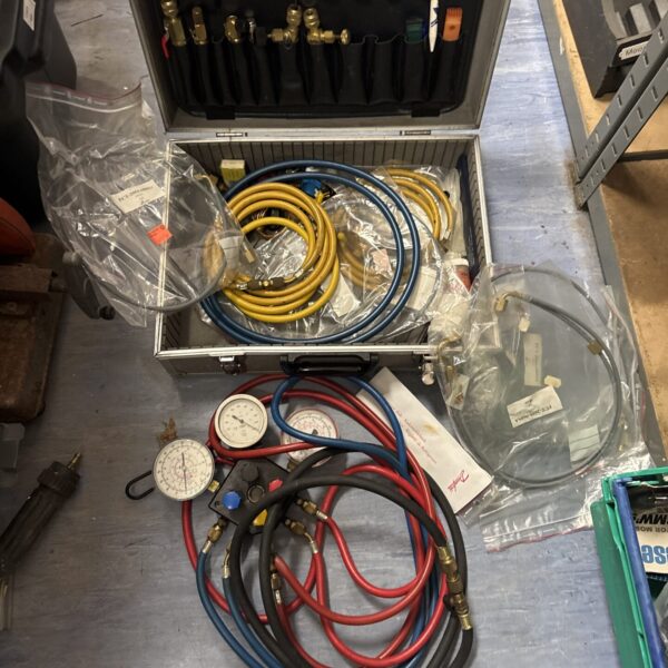 Vintage air conditioning service kit with manifold gauge set.