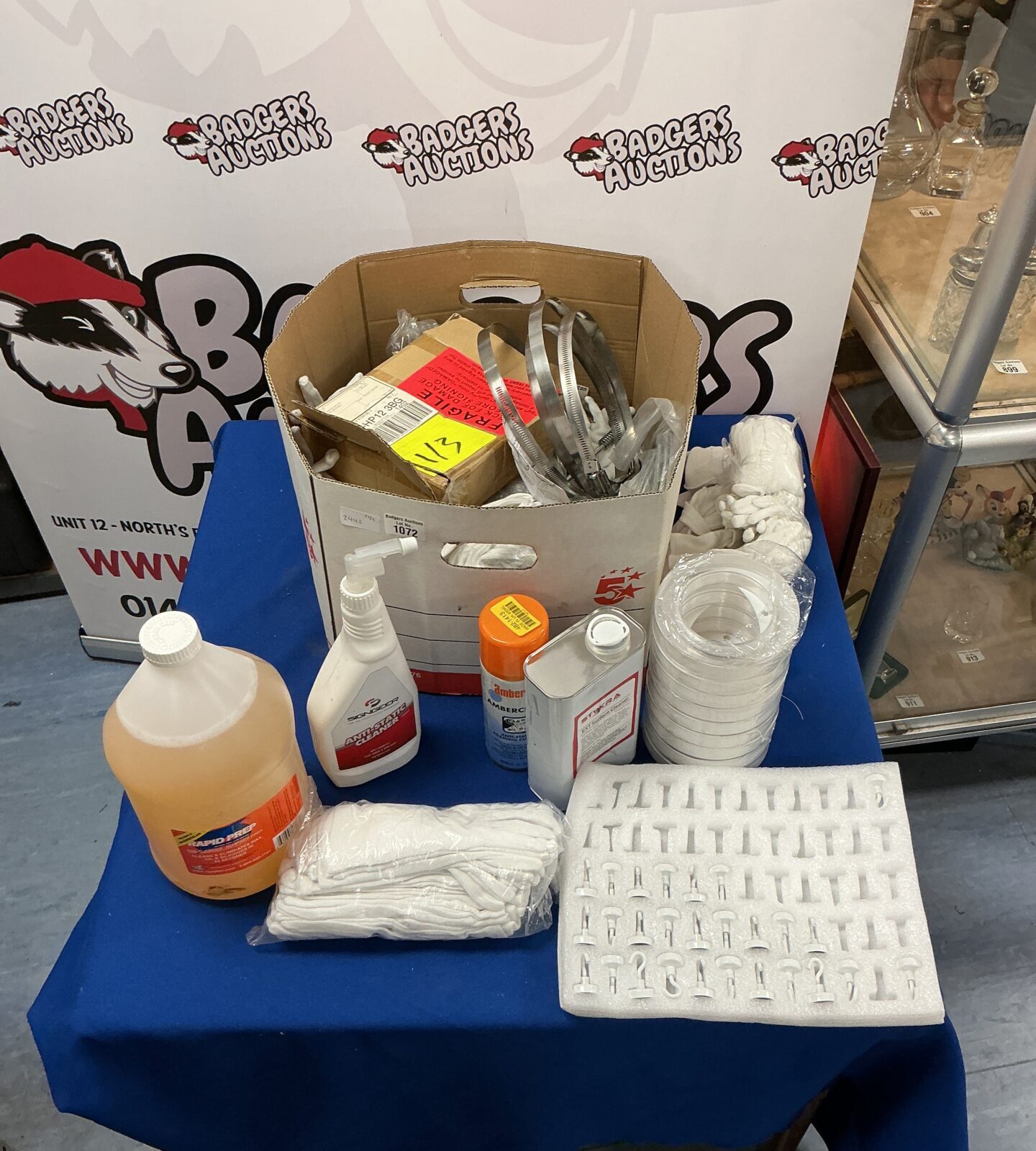 Box of cleaning products and hardware