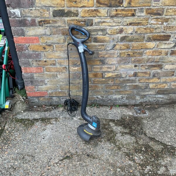 Mac Allister MGT300 electric strimmer for garden maintenance and trimming.