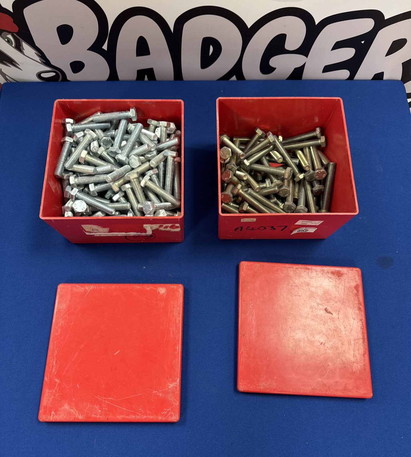 Two tubs of large bolts