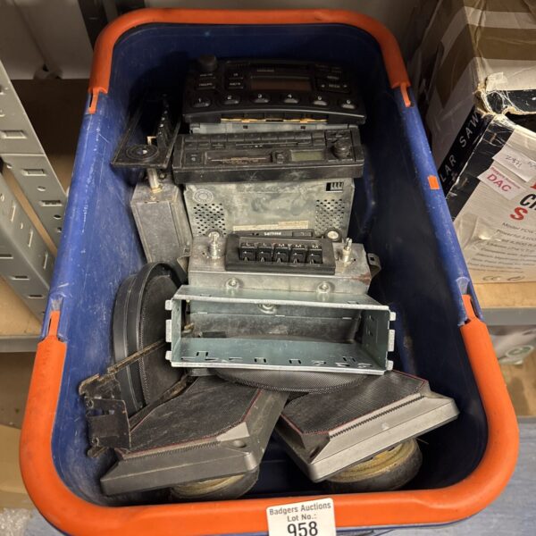 Vintage car audio components in a blue storage box.