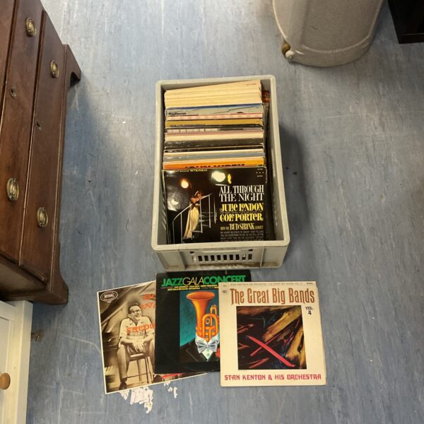Crate of assorted vintage vinyl records for collectors.