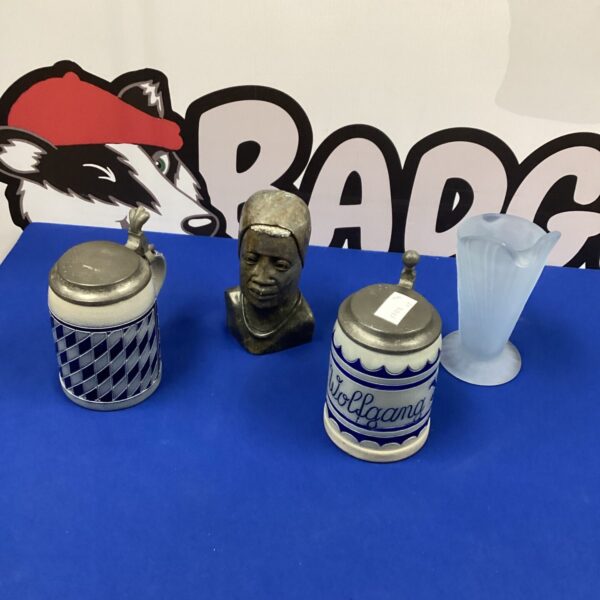 Two German Beer Steins with carved head and vase