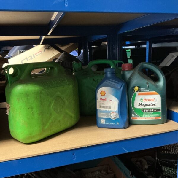 Three petrol cans & 2 part used bottles of engine oil