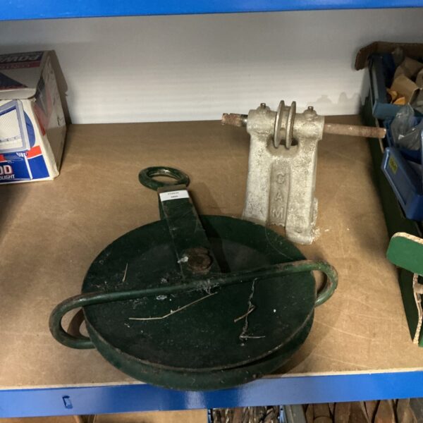 Large vintage cast iron pulley wheel for antique machinery.