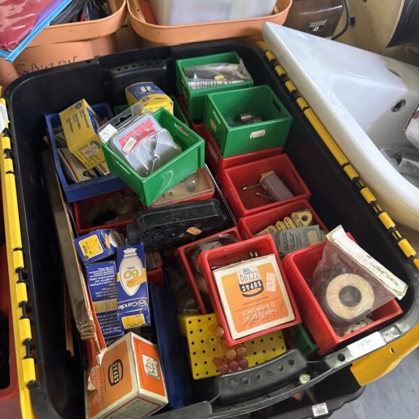 Mixed lot of vintage electrical components in a yellow box.