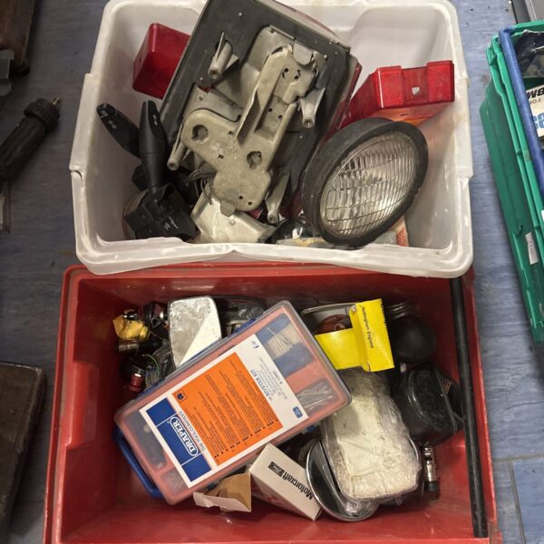 Two boxes of motoring related items