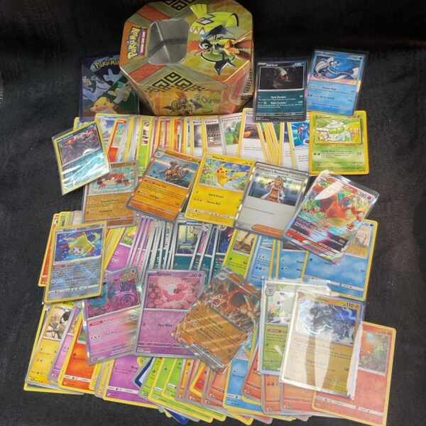 Tin of assorted Pokemon Cards