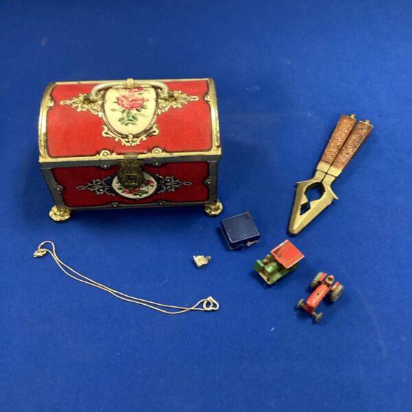 Decorative tin of curios