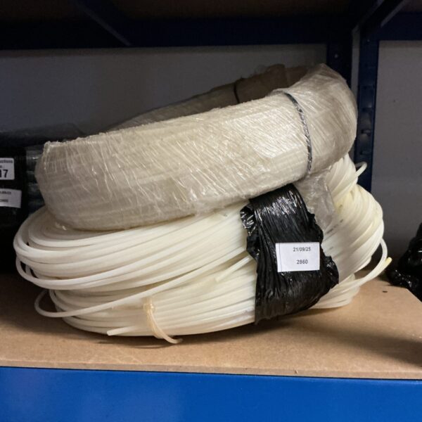 Three rolls of white nylon tubing for pneumatic systems.