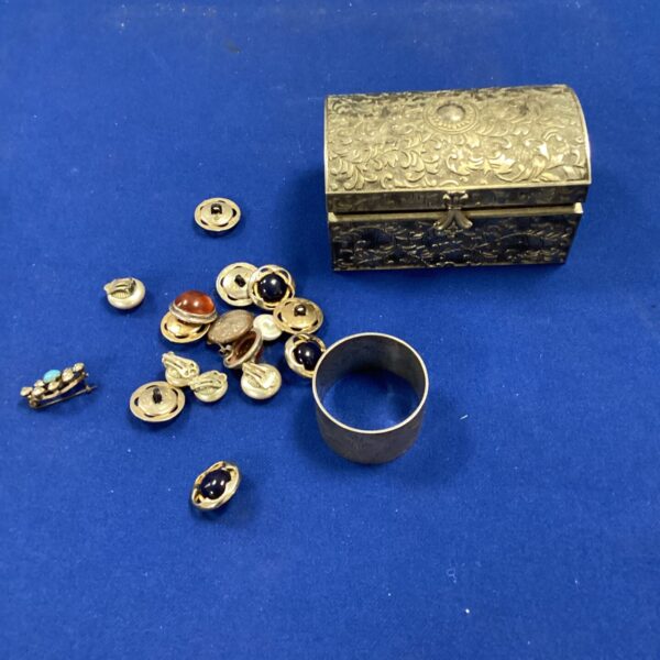 Vintage jewellery lot with decorative white metal box and brooches.