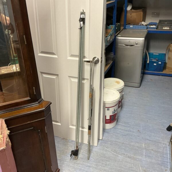 Long bundle of threaded steel rods for DIY projects.