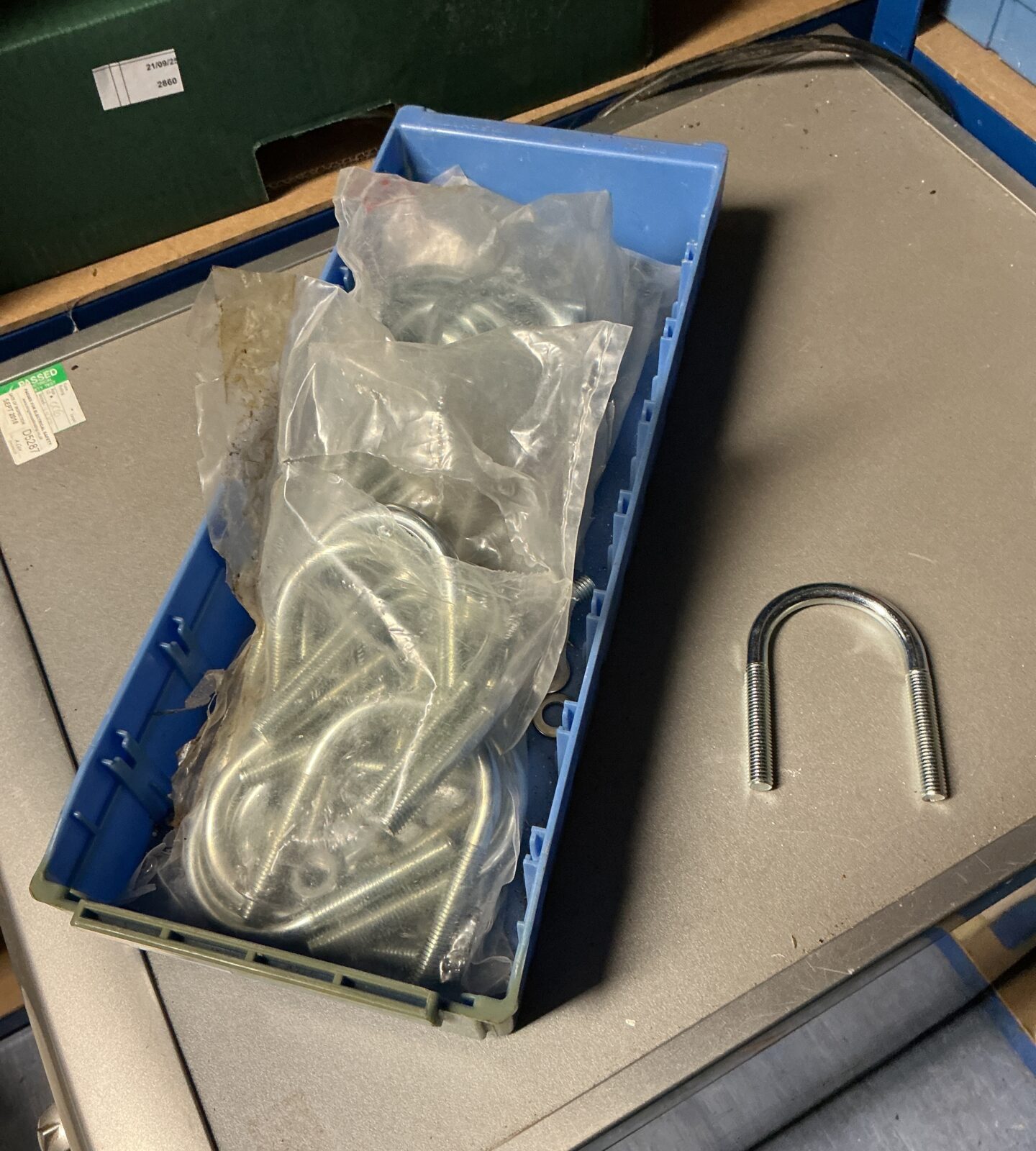 Tray of three packs of new U-bolts