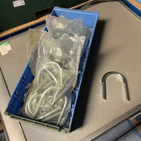 Tray of three packs of new U-bolts