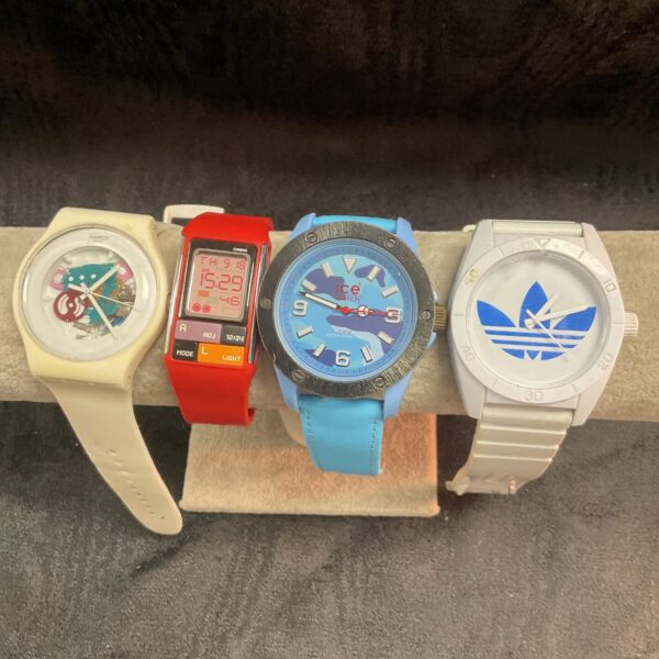 Overview of a sports watch lot including Casio, Ice Watch, Adidas, and Swatch.