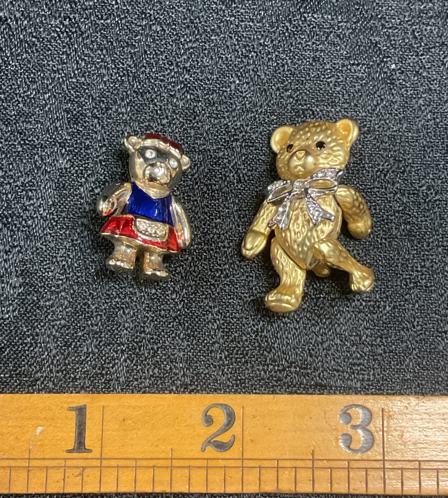 Enamelled teddy bear brooch and articulated gilt teddy bear brooch