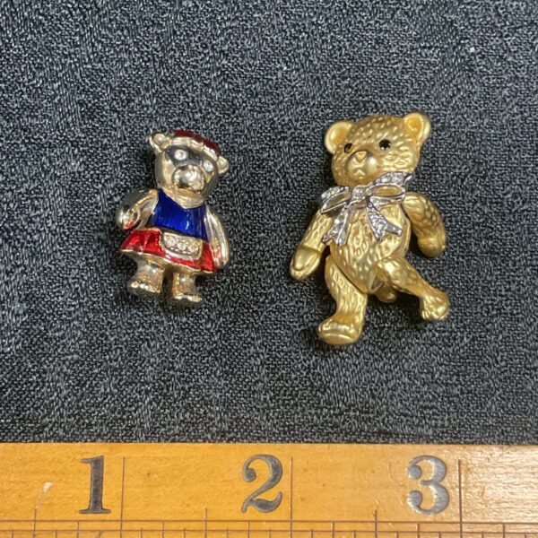 Enamelled teddy bear brooch and articulated gilt teddy bear brooch