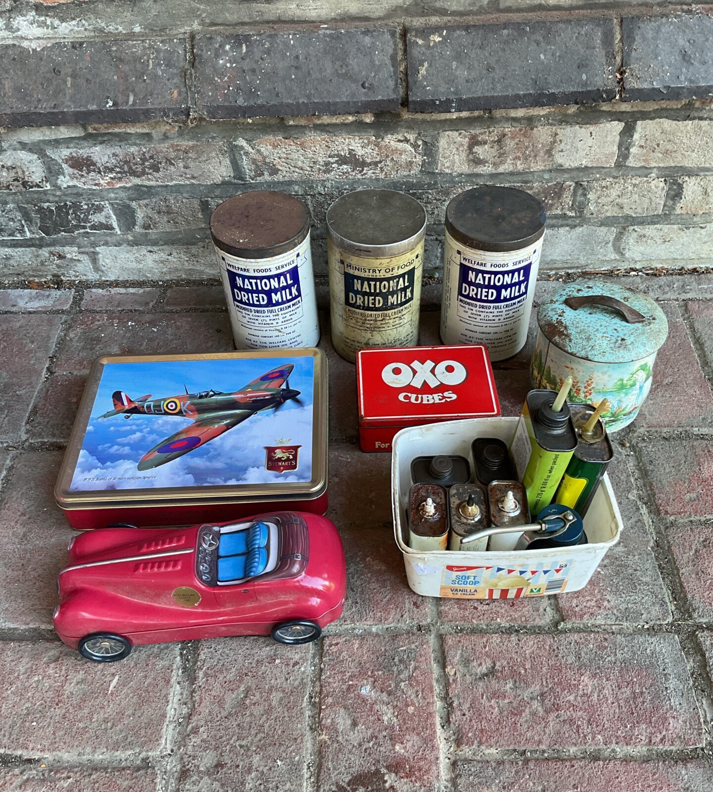 Collection of vintage tin & oil cans including national dried milk cans