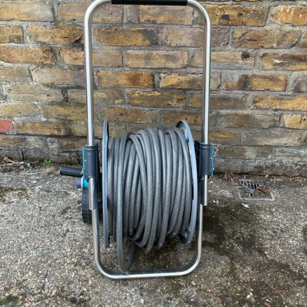 Used Flopro garden hose reel for tidy hose storage.