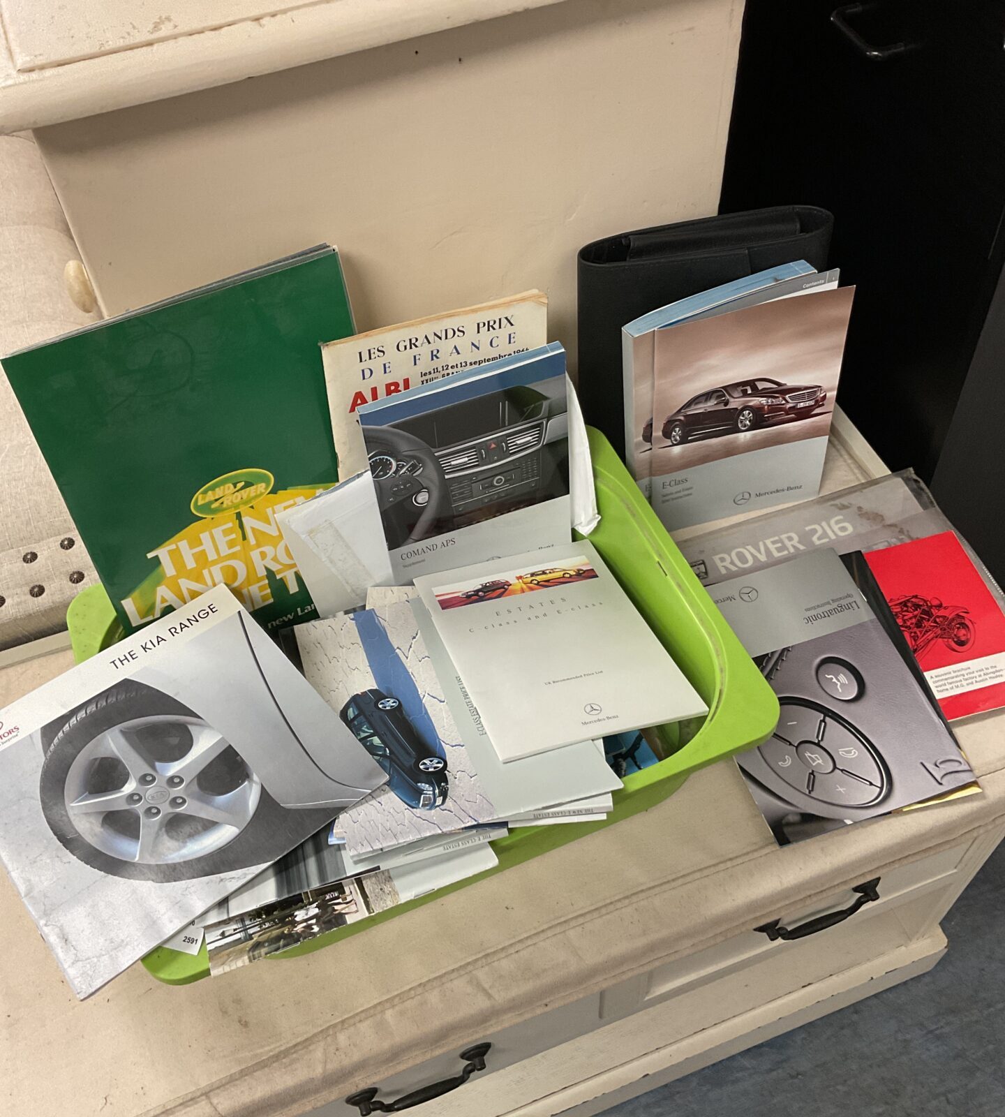 Collection of car owner’s manuals including Mercedes & land rover