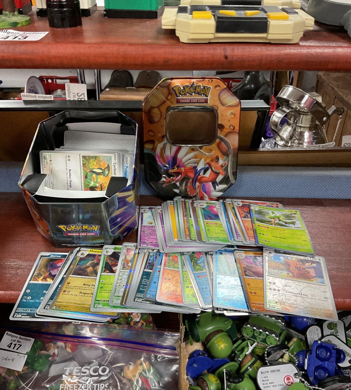 Tin of Pokémon cards, including holos