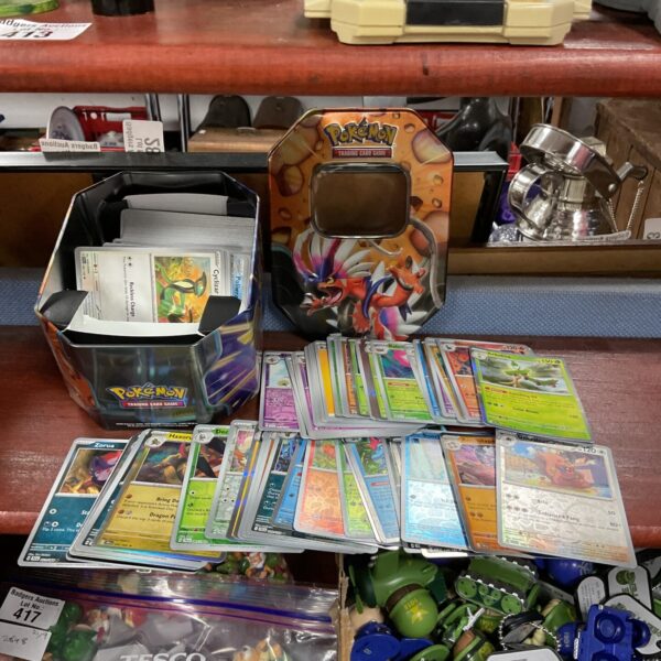 Tin of Pokémon cards, including holos