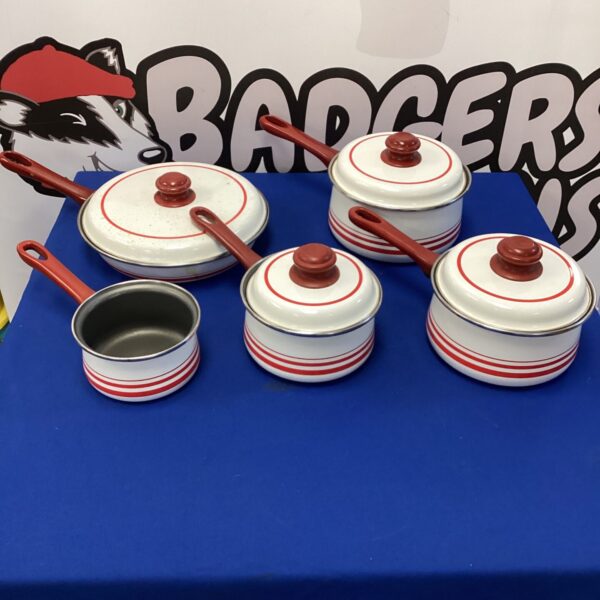 Set of vintage Swan cooking pans with red accents.