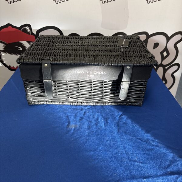Harvey Nichols hamper basket with woven design and handle.