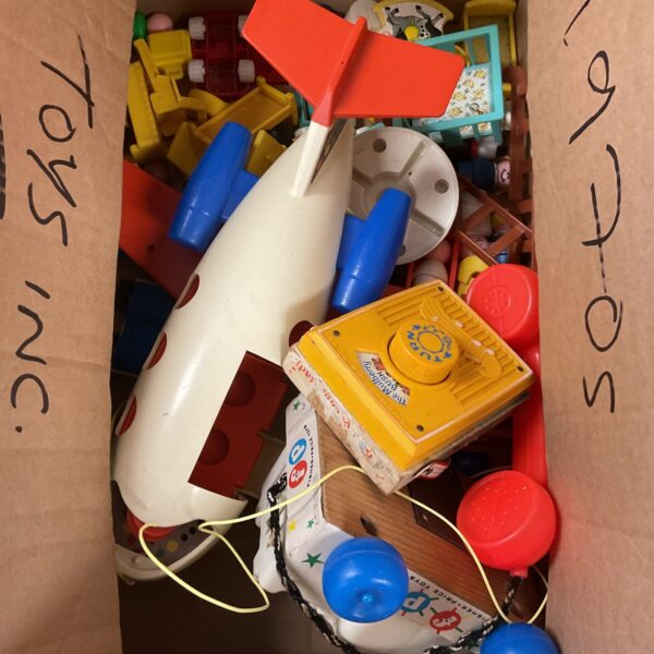 Vintage Fisher Price toy lot with colourful plastic toys.