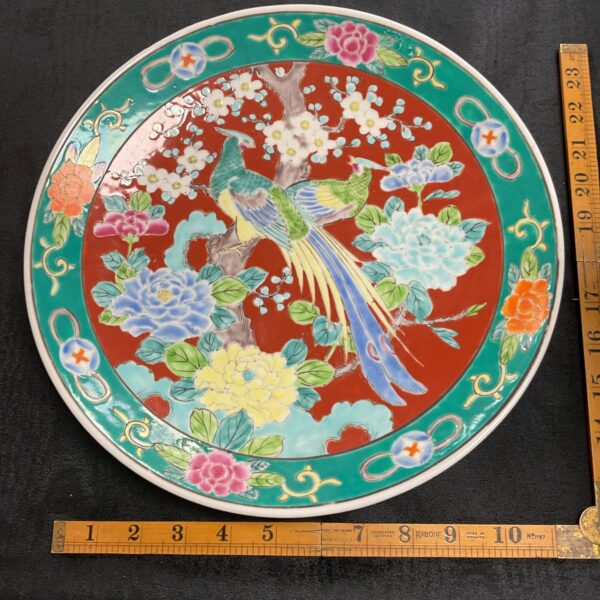 Vintage Japanese Famille Rose Imari plate with bird of paradise design.