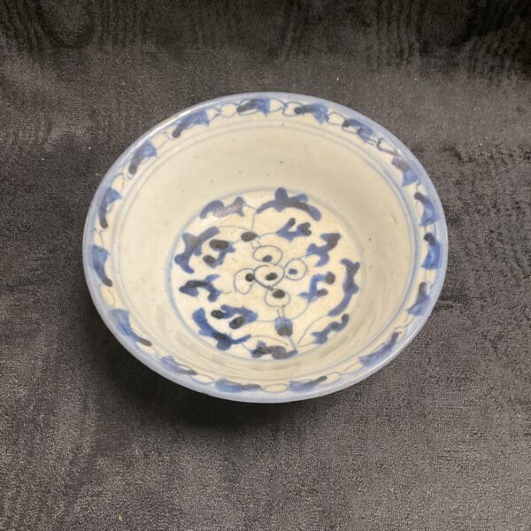 Antique Chinese blue and white porcelain bowl with floral design.