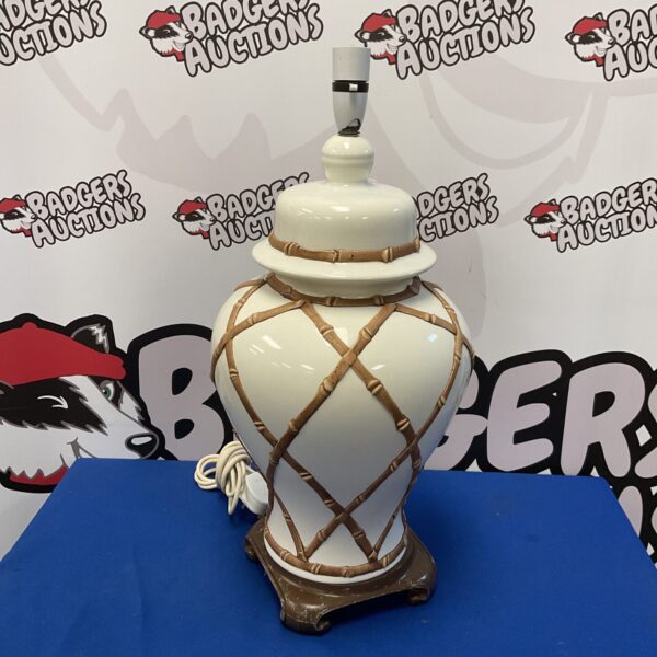 Vintage 20th-century bamboo table lamp with ceramic vase.