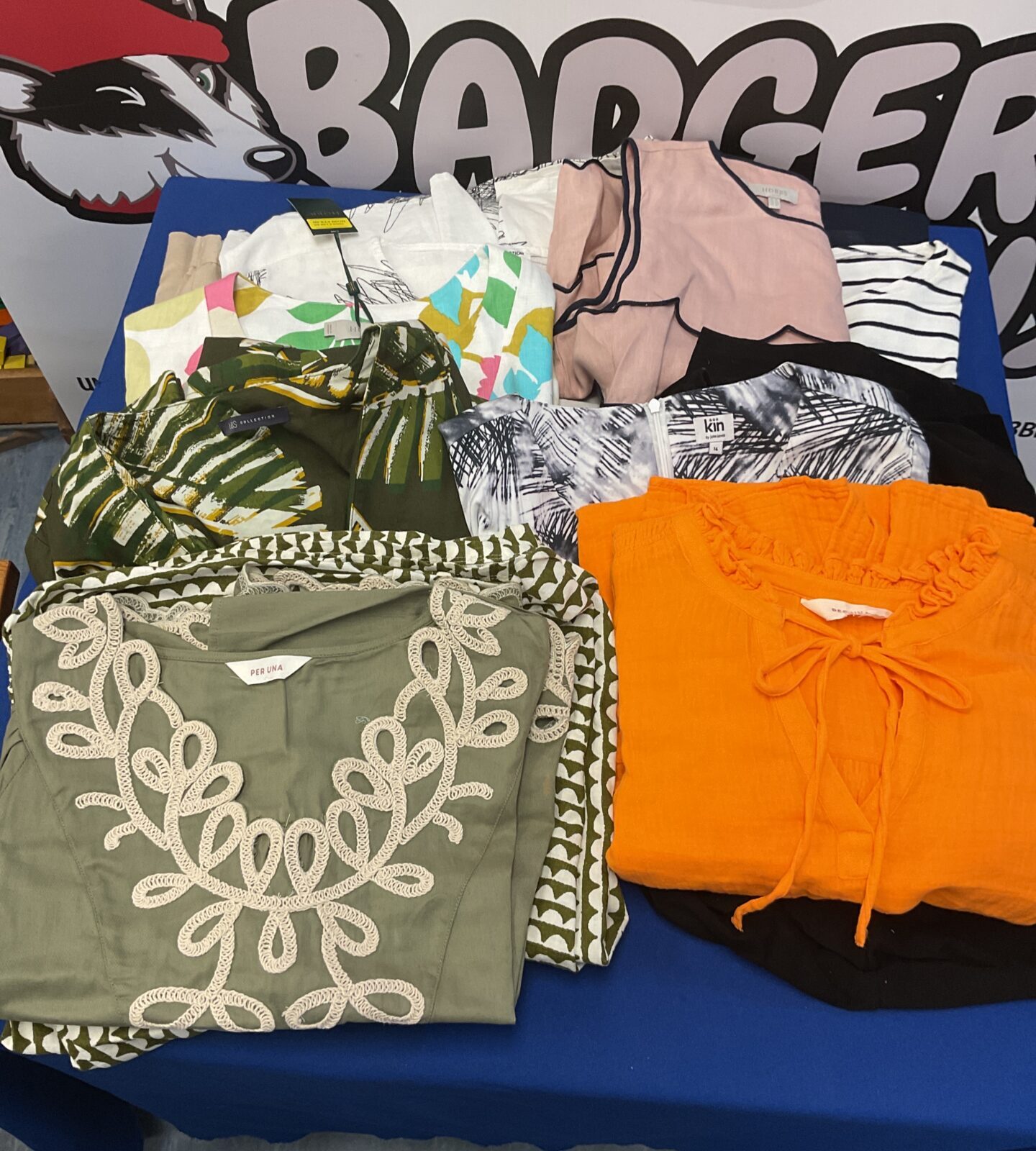 Collection of designer dresses tops skirts some still with labels on