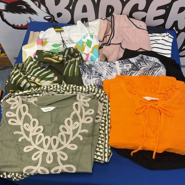 Collection of designer dresses tops skirts some still with labels on