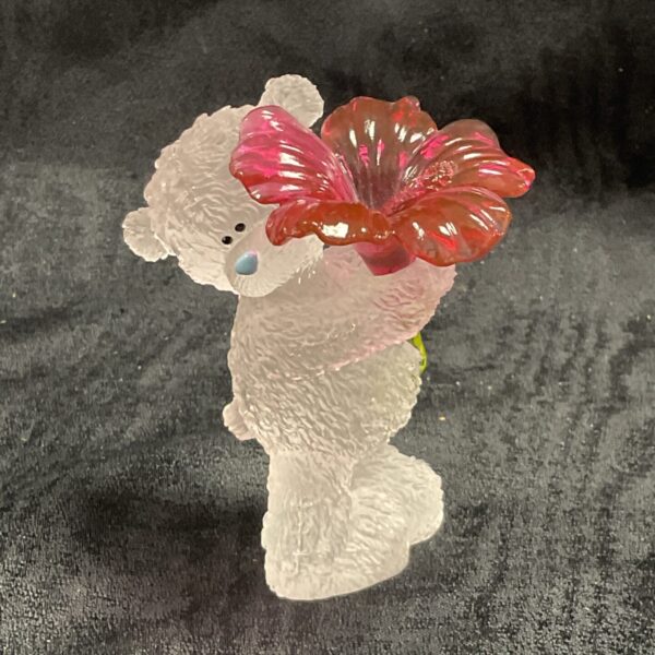 Front view of Me to You crystal bear with red exotic bloom flower.