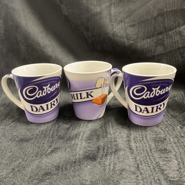 Three Cadbury dairy milk mugs