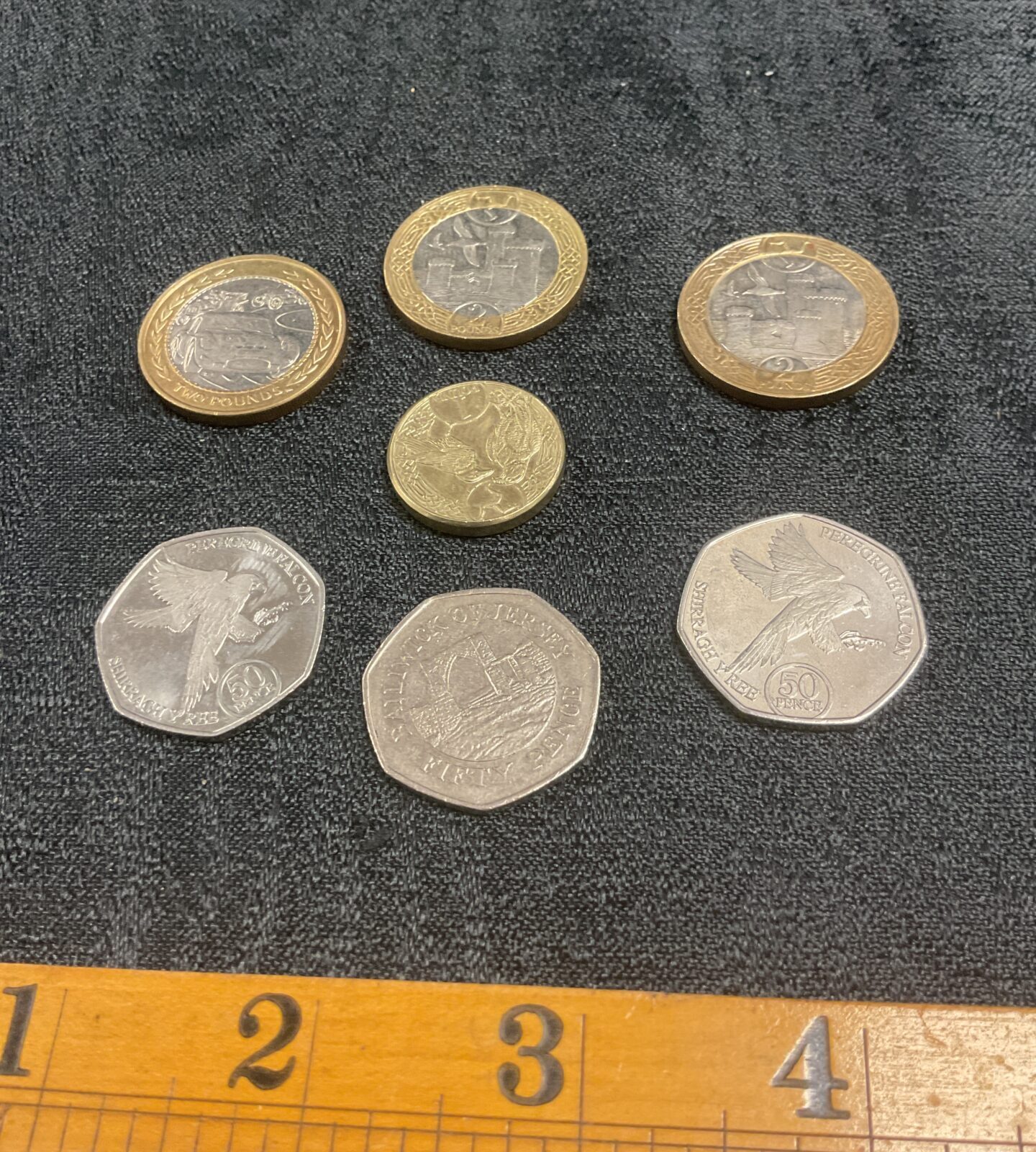three isle of man £2 coins two 50p and £1 and jersey 50p