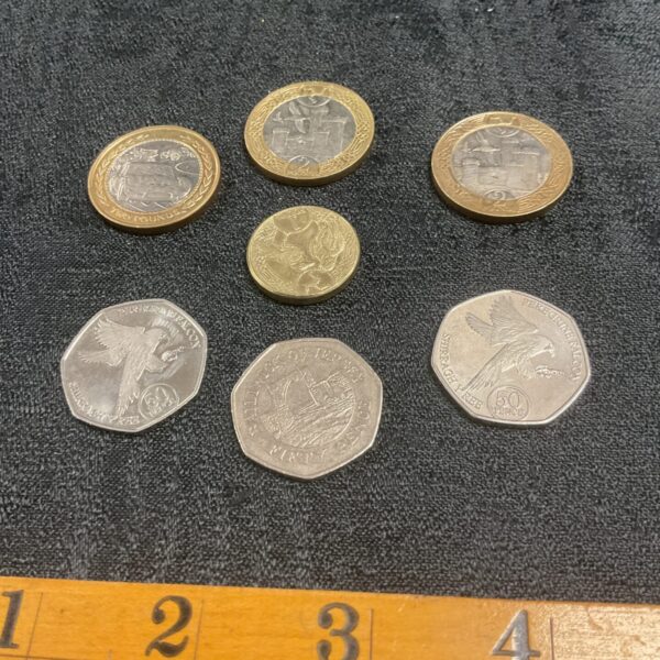 three isle of man £2 coins two 50p and £1 and jersey 50p