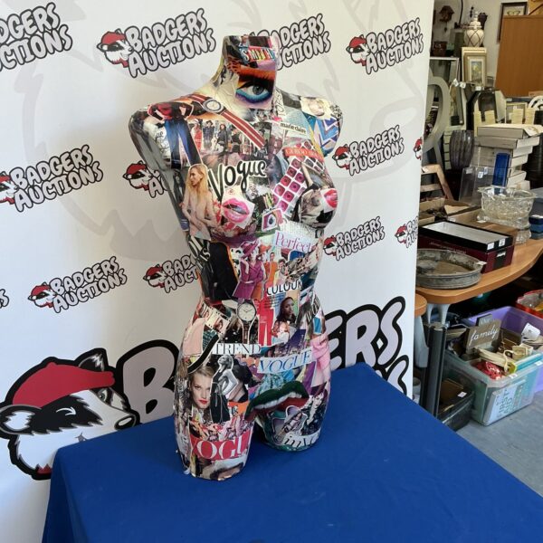 Vibrant modern art manikin with magazine collage design.
