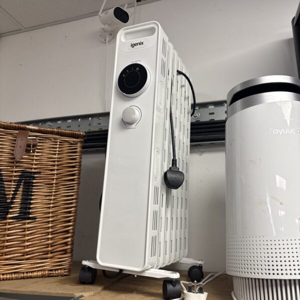 White Igenix oil filled radiator for portable home heating.