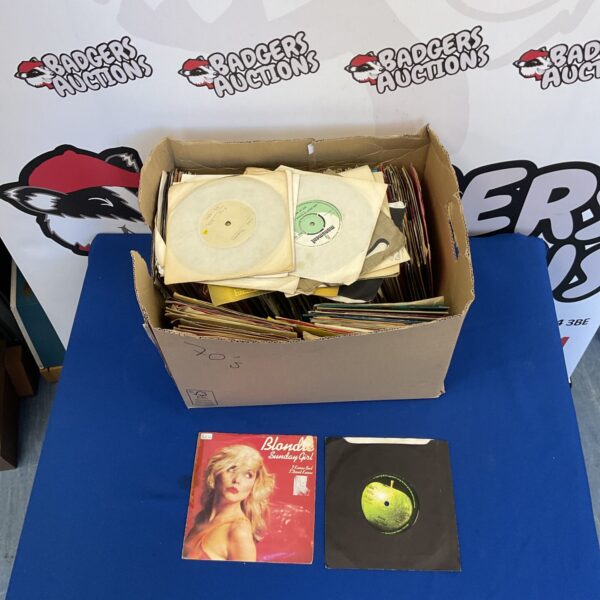Collection of vintage 7-inch vinyl singles for music collectors.