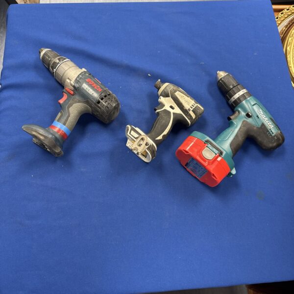 Cordless power tools lot including Makita and Bosch drill and impact driver.