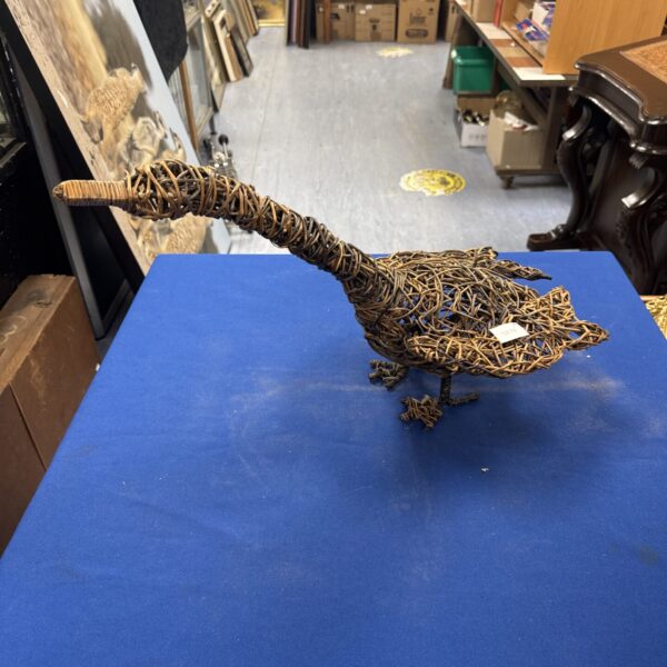 Charming wire garden duck ornament for outdoor decoration.
