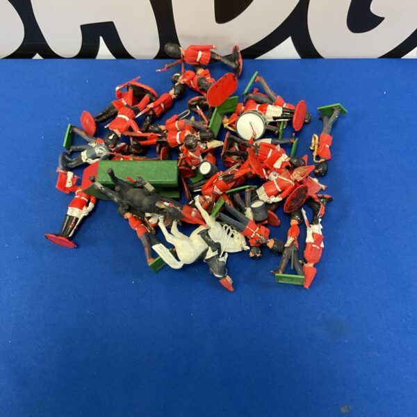 Vintage Britains and Crescent guard figures, collectible toy soldiers.