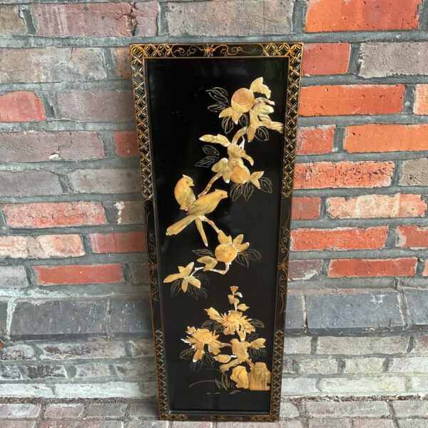 Vintage Chinese lacquered panel with carved birds and lotus flowers.