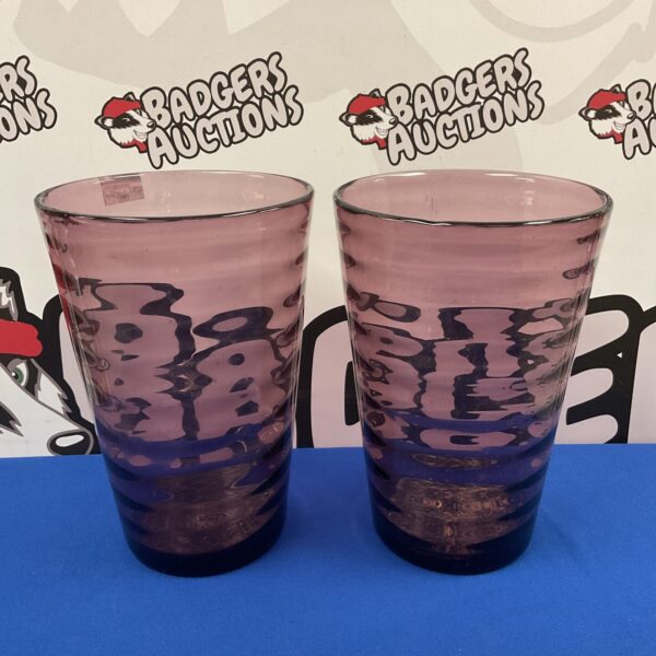 Pair of tall, ribbed ruby glass vases for home decor.