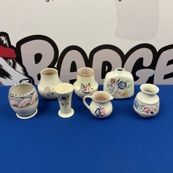 Vintage Devon pottery creamer with colourful floral design.