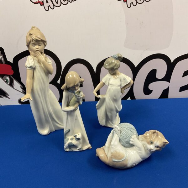 Vintage Lladro Nao figurine of a girl with a cat.