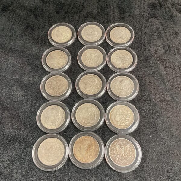 Lot of fifteen reproduction Morgan Dollar coins for collectors.